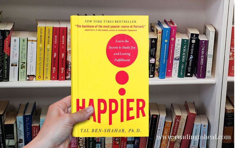 Happier: Learn the Secrets to Daily Joy and Lasting Fulfillment by Tal Ben-Shahar on a bookshelf