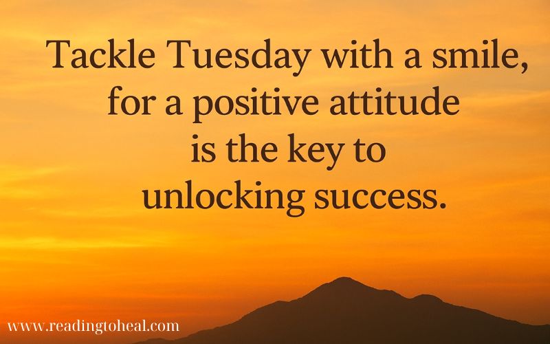 Positive Tuesday motivational quote over a beautiful sunset mountain landscape about unlocking success with a smile.