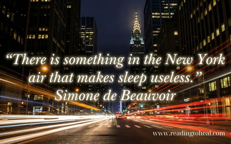 Long exposure of New York City traffic at night featuring the phrase 'The City That Never Sleeps.'