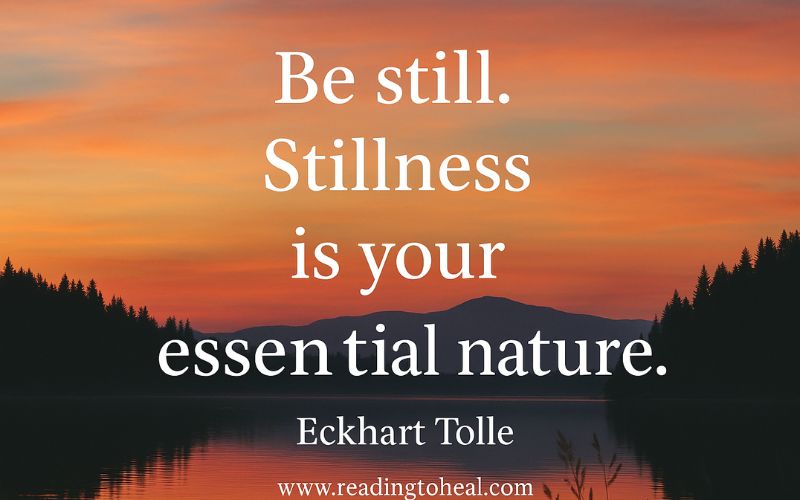 Eckhart Tolle quote about stillness being our essential nature over a forest landscape.
