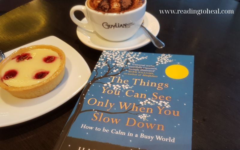 A person sitting calmly reflecting on life, representing the 'slow down' philosophy of the book.