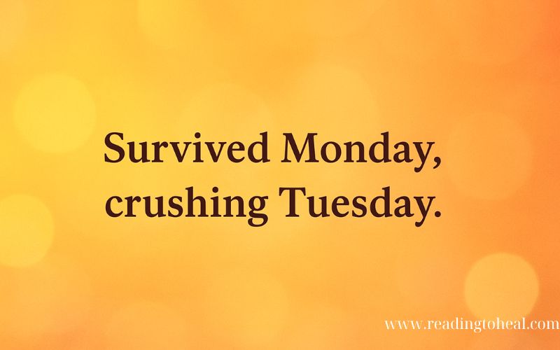 Motivational workplace quote on warm orange background stating Survived Monday, crushing Tuesday.