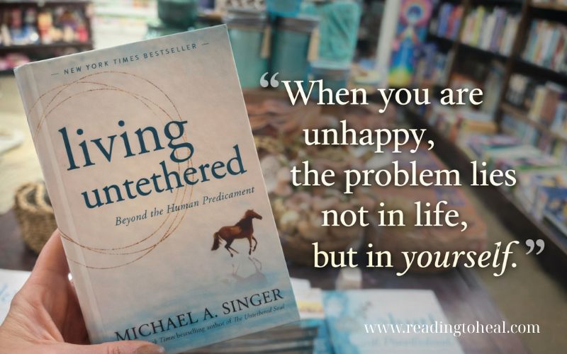 Living Untethered quote about unhappiness and self-awareness over a soft spiritual background